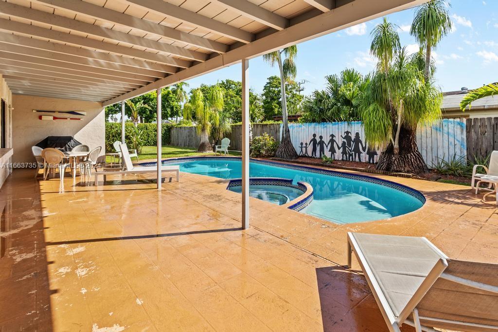 The Hammocks Miami, FL 33186 - Photo 45 of 62 a view of a swimming pool with a patio and a yard