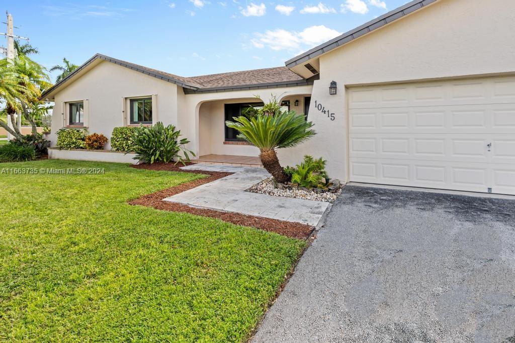 The Hammocks Miami, FL 33186 - Photo 51 of 62 a front view of a house with a yard and garage