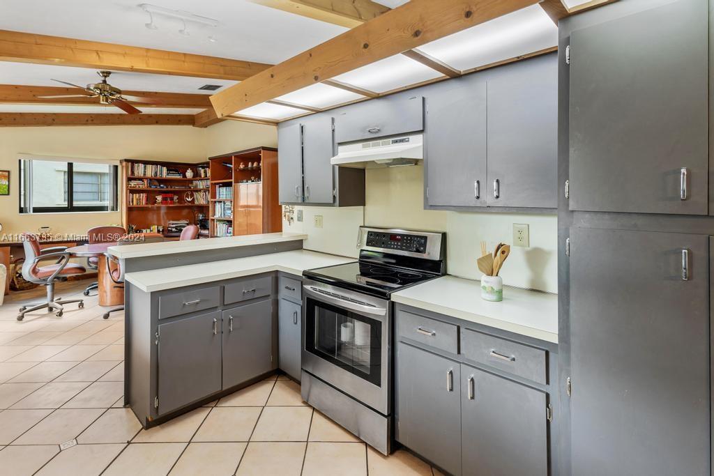 The Hammocks Miami, FL 33186 - Photo 10 of 62 a kitchen with stainless steel appliances granite countertop a sink stove and cabinets
