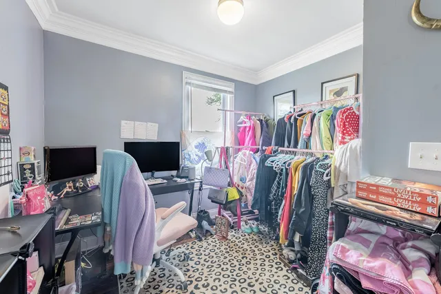 a view of a workspace with furniture and a couch
