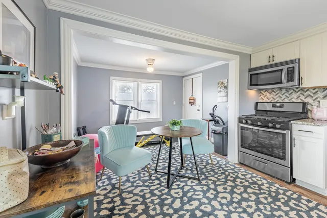 a living room with furniture and a table