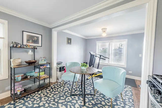 a living room with furniture a rug and a window