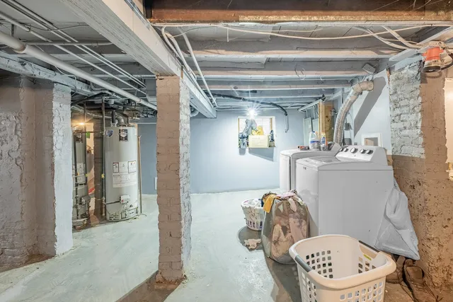 a bathroom with a toilet a sink and a mirror