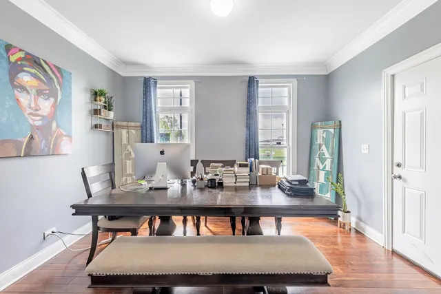 a view of a dining room with furniture window and wooden floor