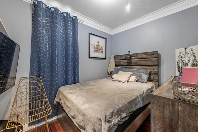 a bedroom with a bed and a desk