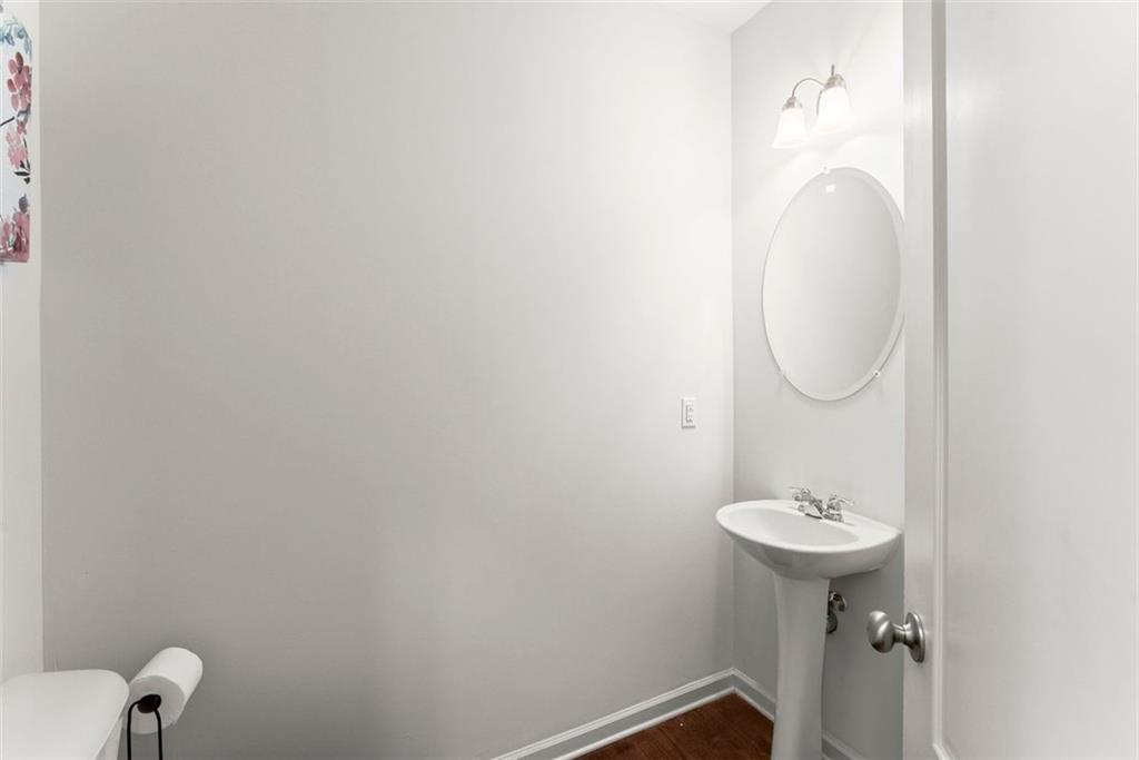 5713 Radford Loop Fairburn, GA 30213 - Photo 13 of 43 a bathroom with a sink toilet and a mirror