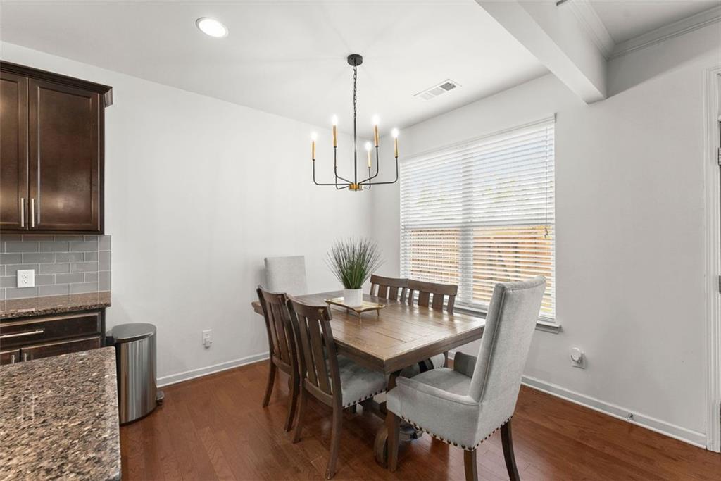 5713 Radford Loop Fairburn, GA 30213 - Photo 14 of 43 a view of a dining room with furniture window and wooden floor