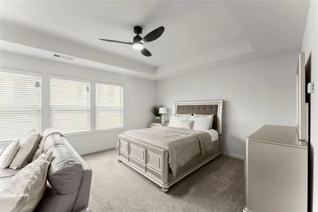 a bed room with a bed and a couch