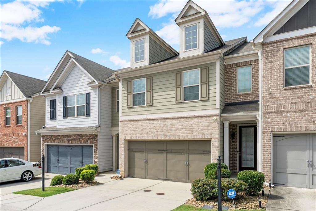 5713 Radford Loop Fairburn, GA 30213 - Photo 2 of 43 a front view of a house with yard