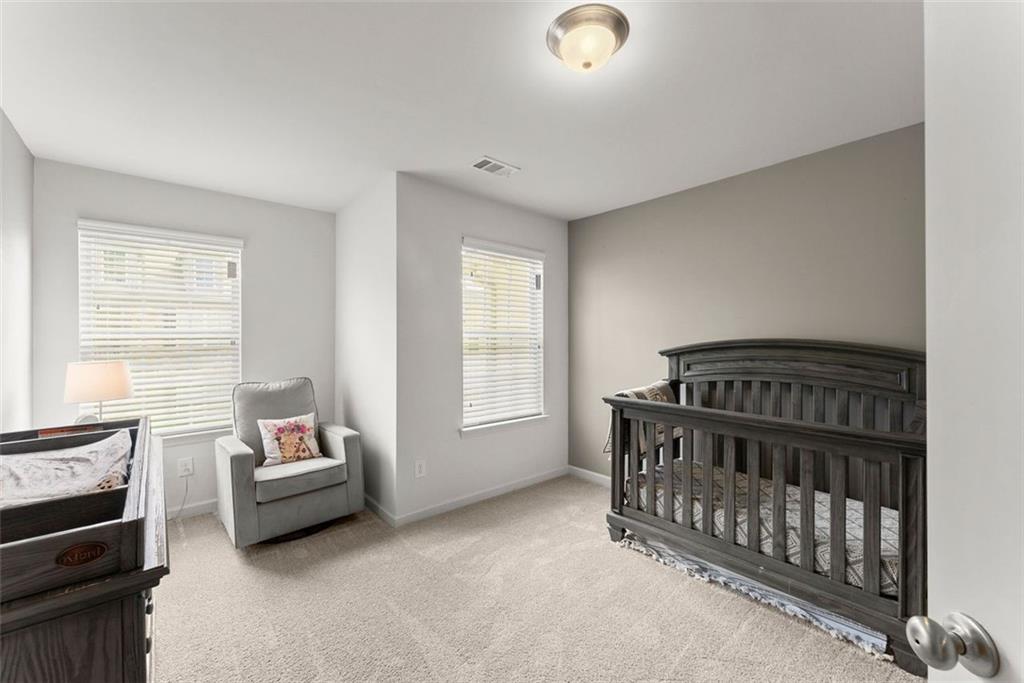 5713 Radford Loop Fairburn, GA 30213 - Photo 25 of 43 a living room with furniture and a window