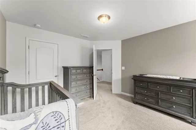 a view of a bedroom with furniture