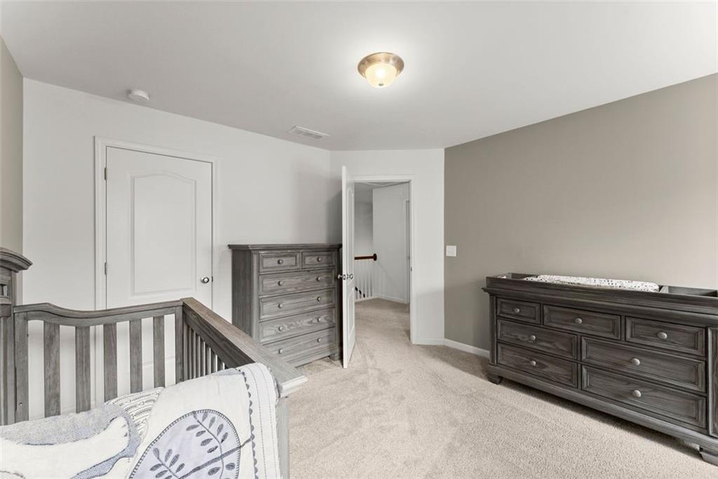5713 Radford Loop Fairburn, GA 30213 - Photo 27 of 43 a view of a bedroom with furniture
