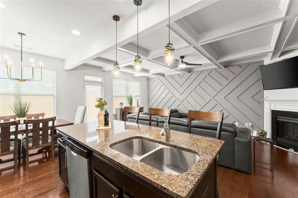 5713 Radford Loop Fairburn, GA 30213 - Photo 3 of 43 a kitchen with a sink a counter space appliances and cabinets