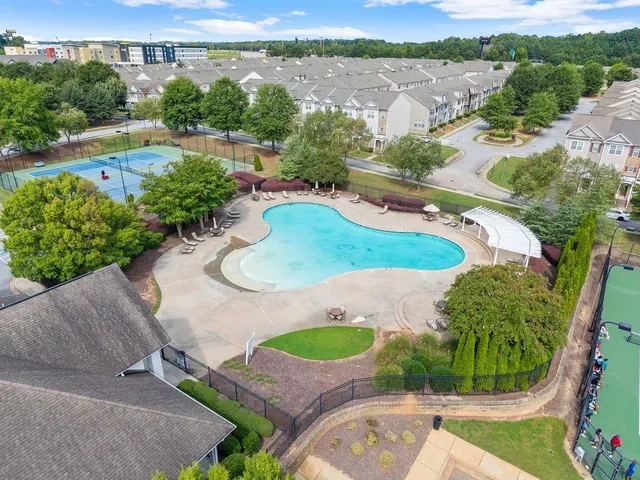an aerial view of a house with outdoor space