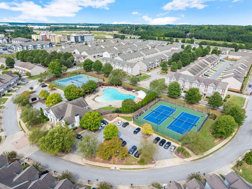 5713 Radford Loop Fairburn, GA 30213 - Photo 41 of 43 an aerial view of residential houses with outdoor space and swimming pool
