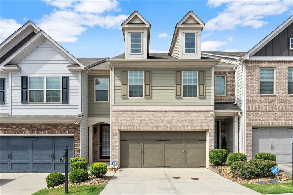 5713 Radford Loop Fairburn, GA 30213 - Photo 5 of 43 a front view of a house with yard