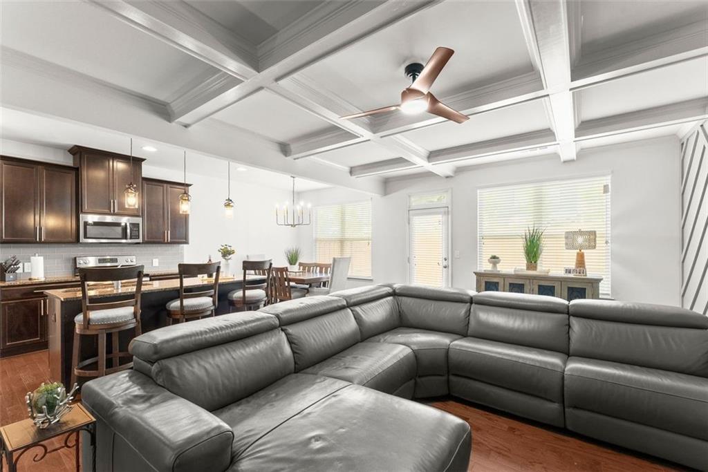 5713 Radford Loop Fairburn, GA 30213 - Photo 6 of 43 a living room with furniture and a large window