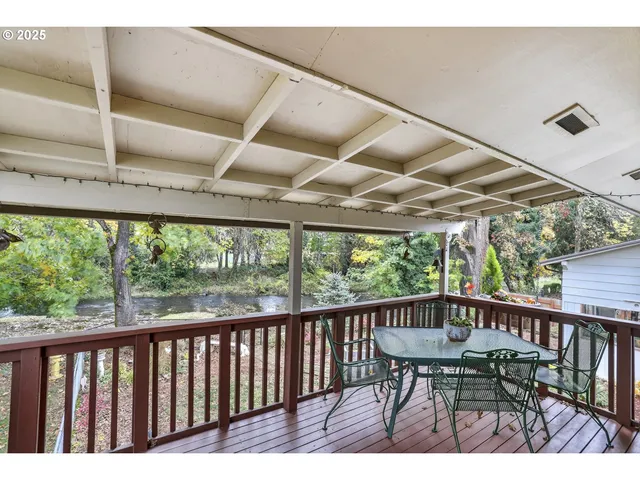 a view of a balcony with wooden floor