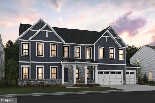 a front view of a residential apartment building with a yard