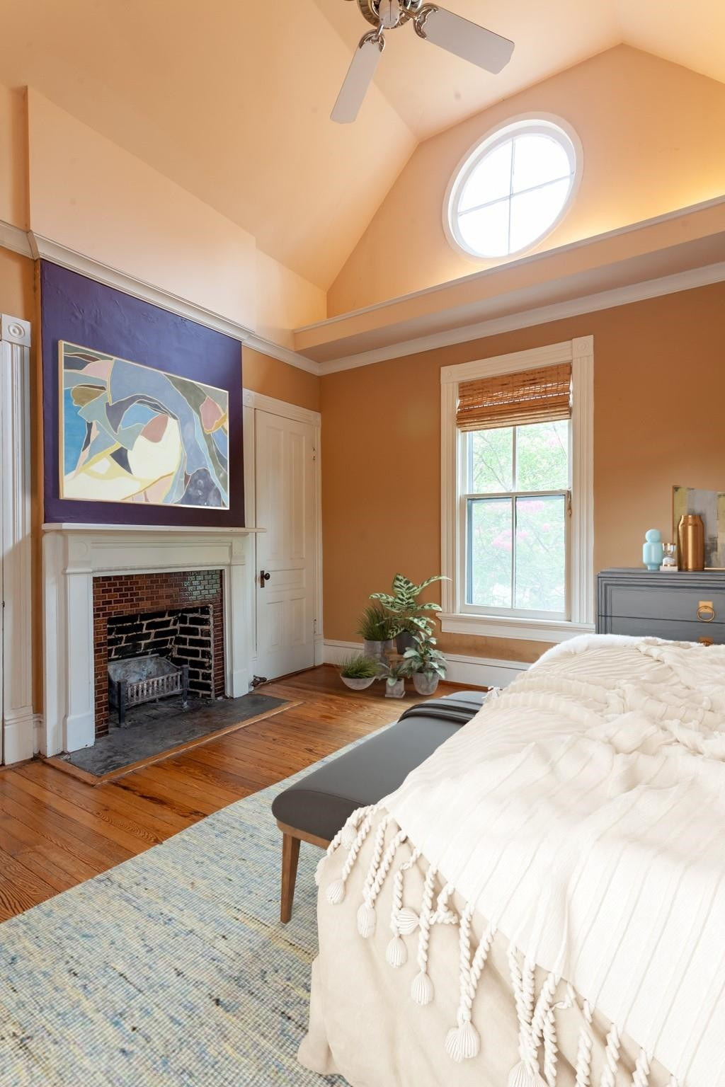 323 Lane Street Raleigh, NC 27601 - Photo 28 of 42 a bedroom with a bed and a fireplace