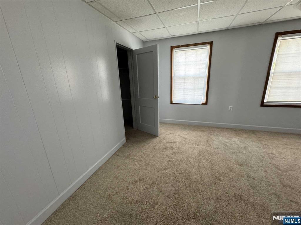 196 Rock Road, Unit 2B Glen Rock, NJ 07452 - Photo 20 of 22 an empty room with windows