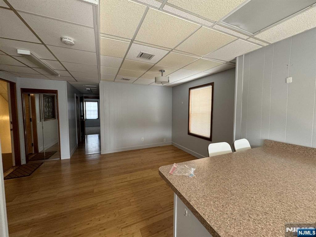 196 Rock Road, Unit 2B Glen Rock, NJ 07452 - Photo 10 of 22 a view of a kitchen with a sink and a wooden floor