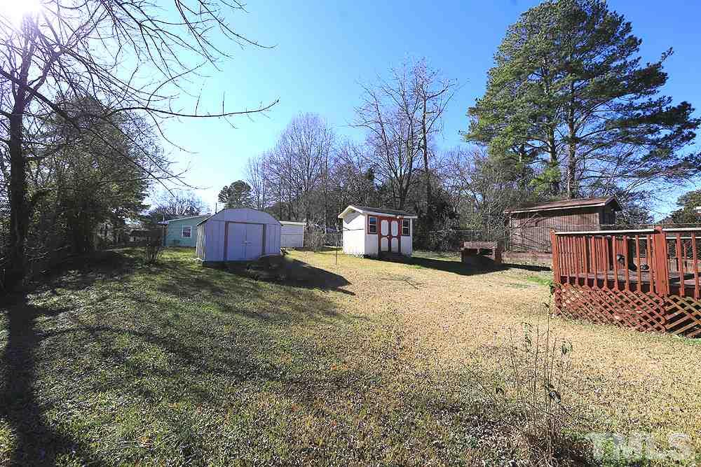 848 Newcombe Road Raleigh, NC 27610 - Photo 13 of 14 a view of a yard covered with snow in the yard