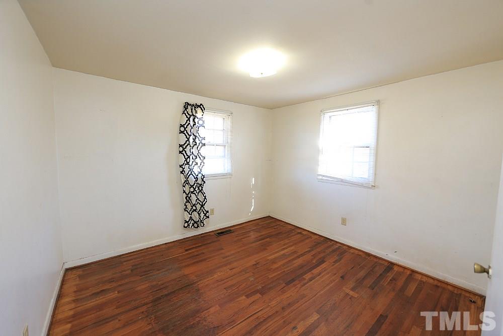 848 Newcombe Road Raleigh, NC 27610 - Photo 9 of 14 an empty room with a window