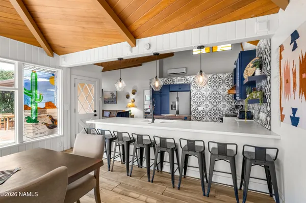 a kitchen with stainless steel appliances granite countertop a sink and wooden cabinets