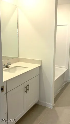 a bathroom with a sink and a shower