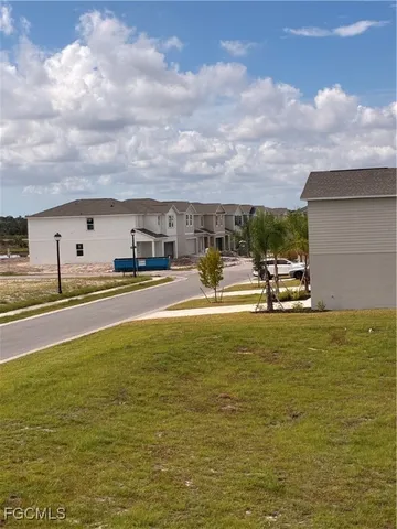 a view of a swimming pool with an outdoor seating