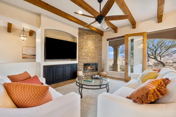 a large white kitchen with a sink and dishwasher a stove with wooden floor