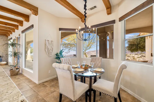 a spacious bedroom with a large bed and a large window