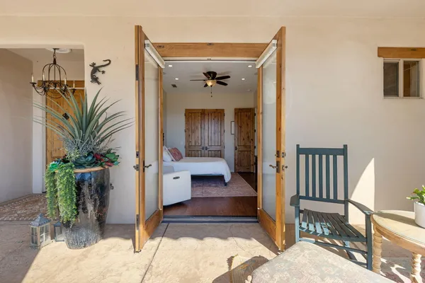 a bedroom with a bed and a painting on the wall