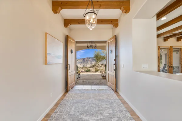 a view of a living room and entry way