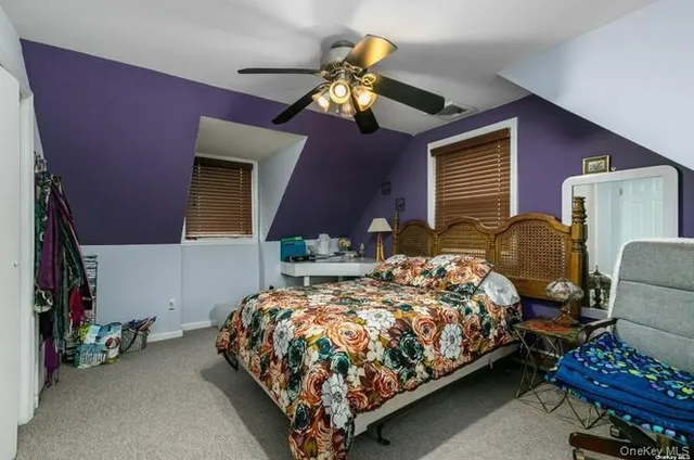 a bedroom with bed and a chandelier