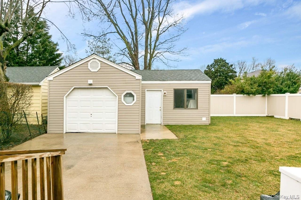 250 North Rutherford Avenue Massapequa, NY 11758 - Photo 19 of 21 a front view of a house with garden