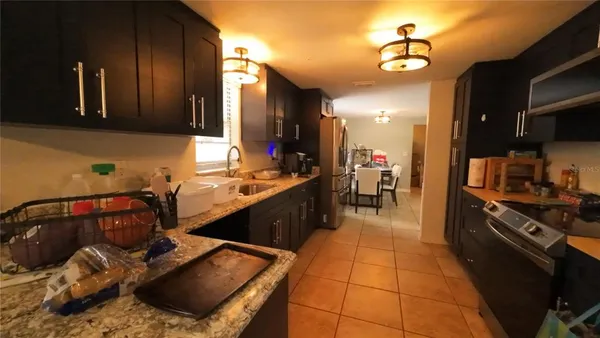 a kitchen with a sink and cabinets