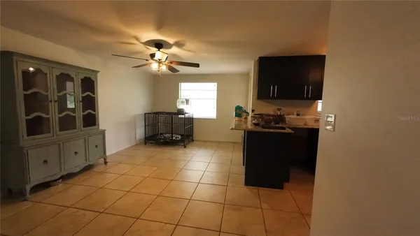 a kitchen with a sink and a refrigerator