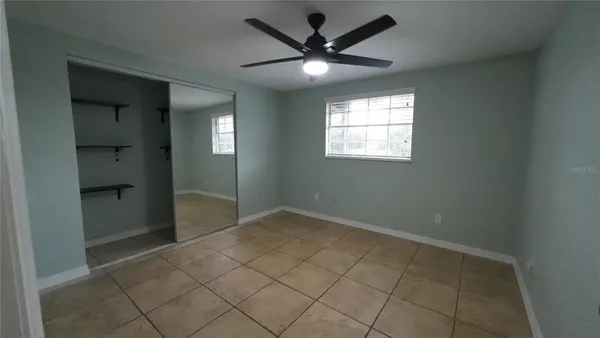 an empty room that has a window in it