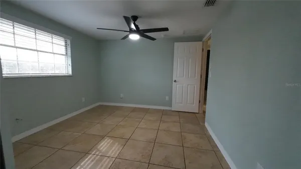 a view of an empty room with a window
