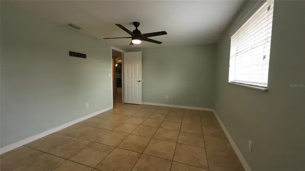 a view of an empty room and window