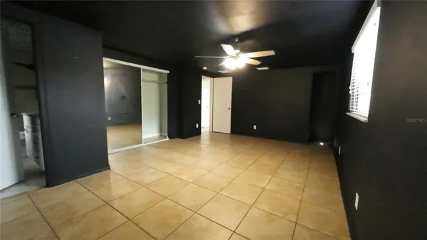 a view of an empty room with a bathroom