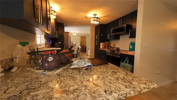 a room with a bed and flat screen tv
