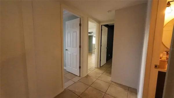 a view of a bathroom with a sink and a mirror