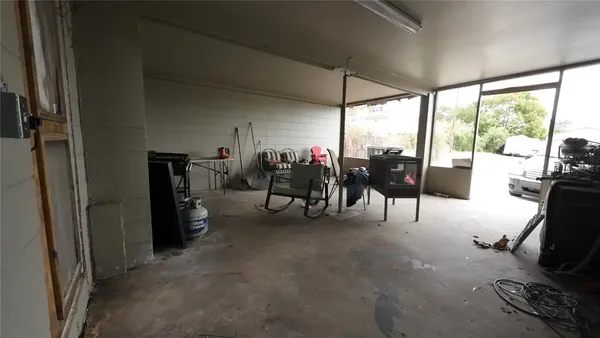 a room with furniture and gym equipment