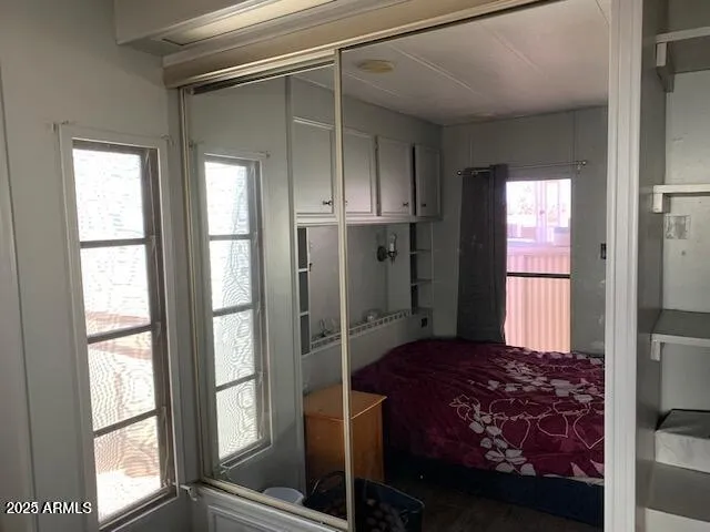 a bedroom with a bed and a window