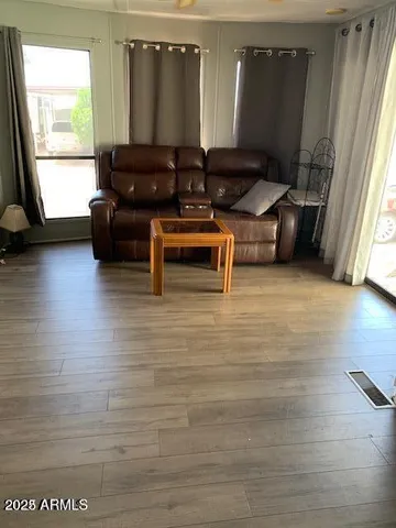 a living room with furniture and a large window