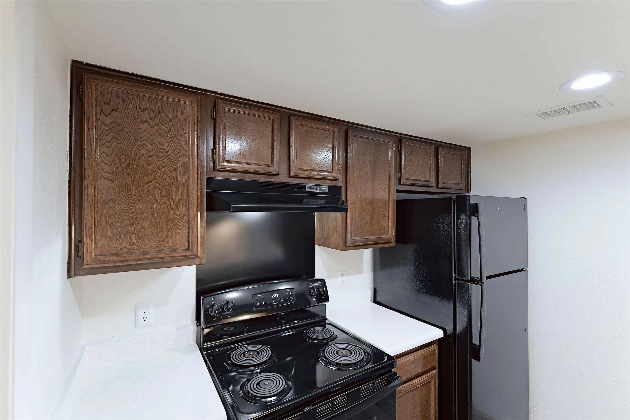 8405 Bent Tree Road, Unit 3412 Austin, TX 78759 - Photo 2 of 20 a kitchen with a refrigerator and a stove