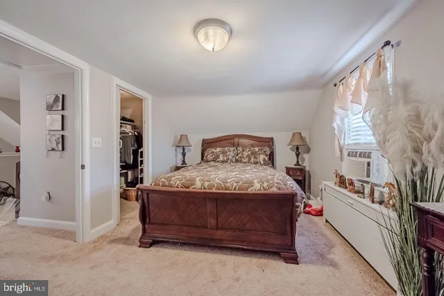 a bedroom with a bed and a cabinets